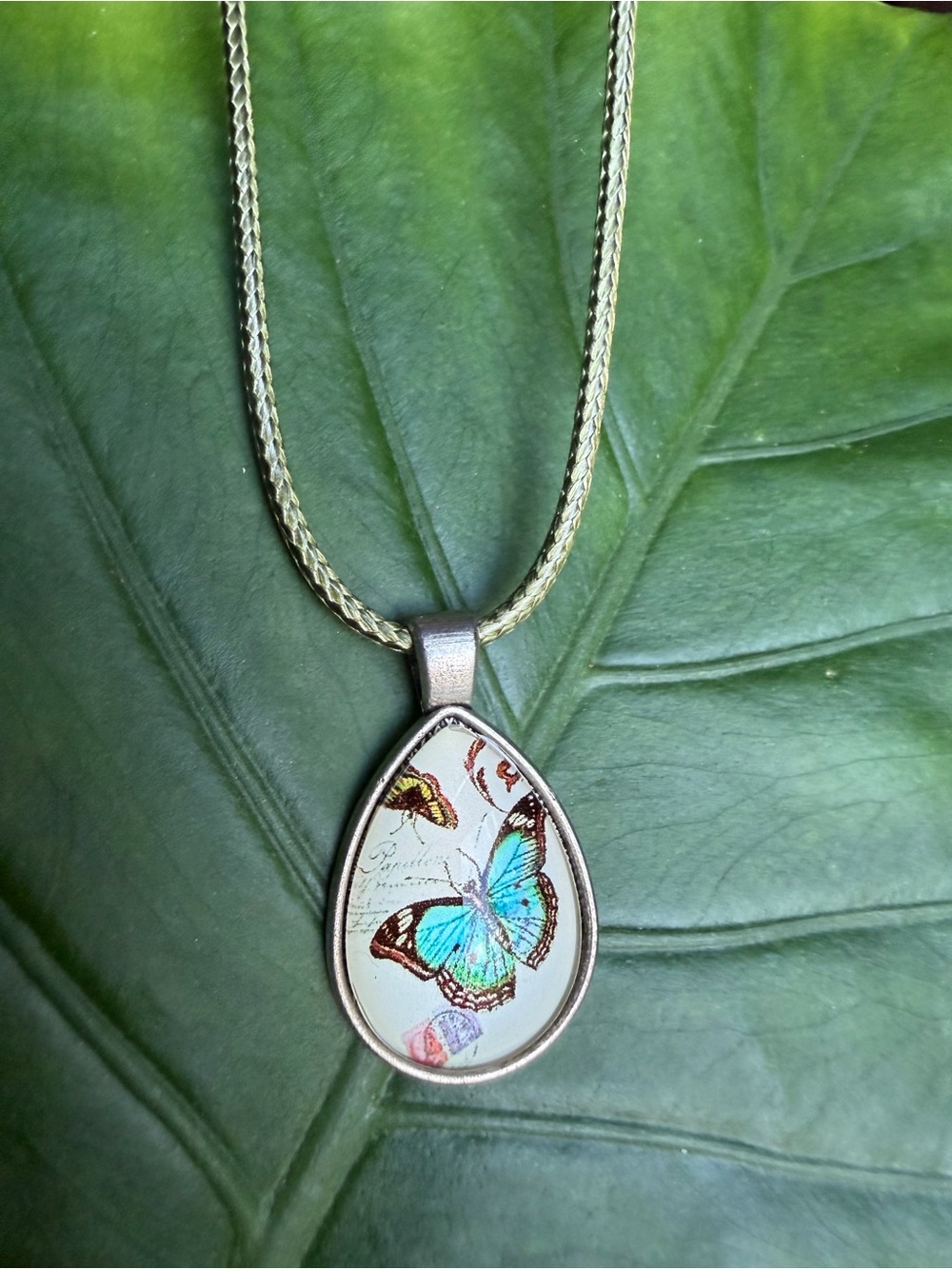 Silver-Tone Teardrop Necklace with Blue Butterfly Resin Pendant